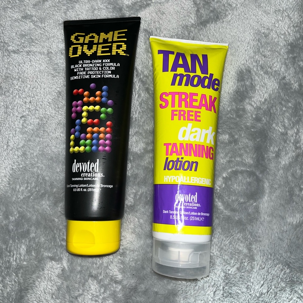 Two tubes of tanning lotion for the tanning bed.